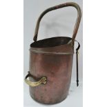 A copper swing handled coal helmet, height overall 57cm.
