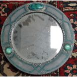 An English Arts & Crafts pewter and enamel round wall mirror fitted with three Ruskin style
