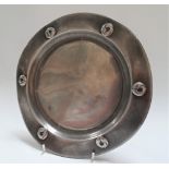 A Tudric pewter dish No.0110, diameter 23.5cm (misshapen).