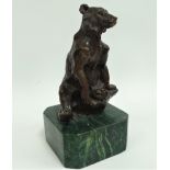 A bronze seated model of a bear after Louis-Albert Carvin, upon a green marble base, height