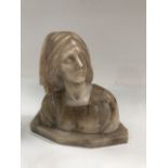 A carved alabaster bust of a woman, height 20cm (base AF).