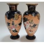 A pair of Doulton Lambeth Slaters Patent vases, tubeline decorated with blossoming branches upon a