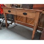 A late 19th century pitch pine dressing table fitted two drawers above turned legs with