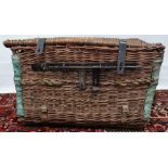 An early 20th century basket weave trunk with metal fittings and rope twist carrying handles,