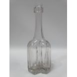 A rare early 18th century clear glass cruciform decanter or serving bottle, height 20.5cm.