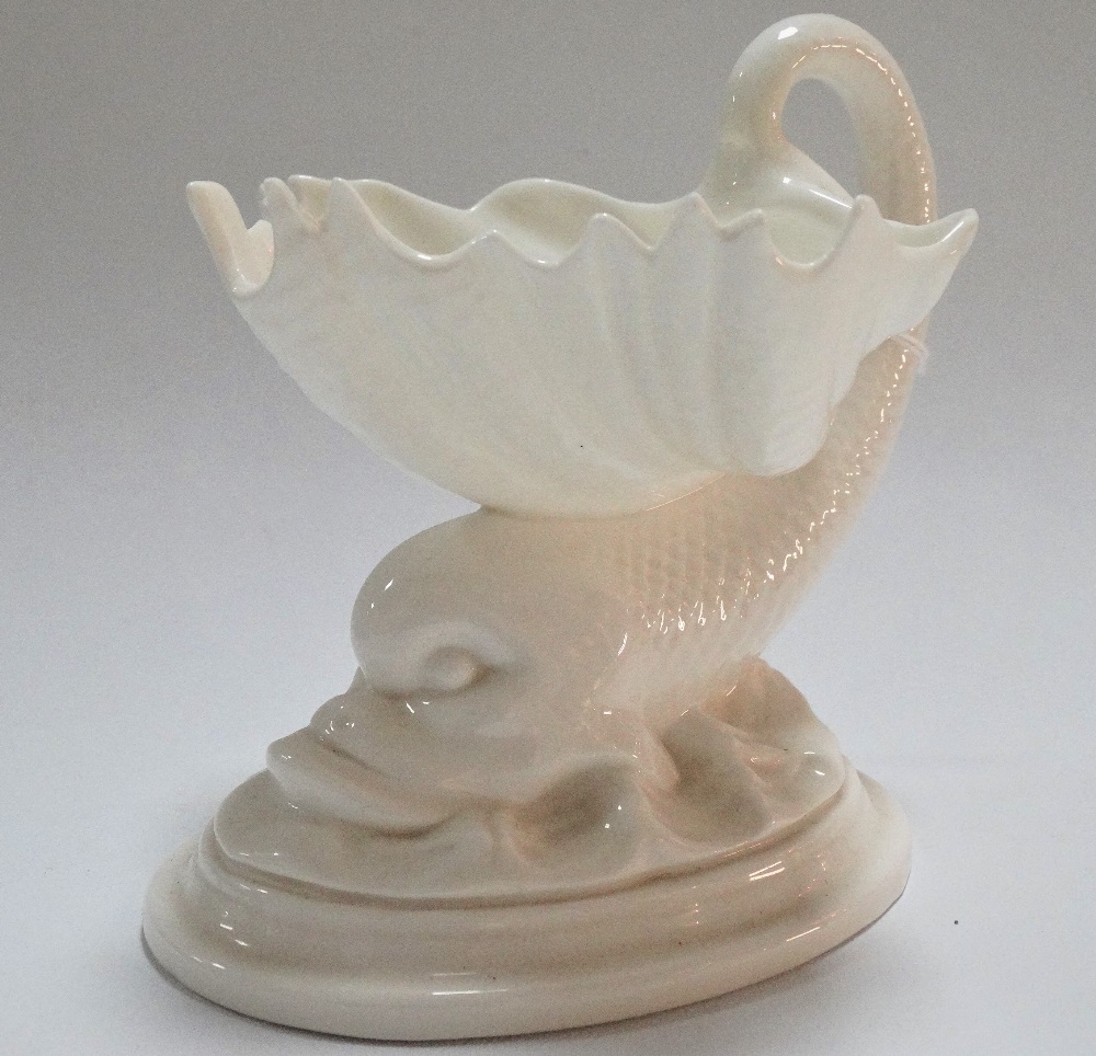 A Royal Worcester blanc de chine table salt in the form of a dolphin and shell, height 11cm.