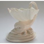 A Royal Worcester blanc de chine table salt in the form of a dolphin and shell, height 11cm.