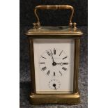 A French brass carriage clock in corniche case, the 2 inch white enamel dial with subsidiary hour