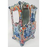 A Delft polychrome decorated model of a sedan chair, monogram to the base, height including lid 21cm