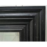 A large ebonised picture frame Overall size 160 x 128cm Aperture size 122 x 91cm Provenance: