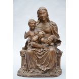 A walnut sculpture 'seated Madonna and Child' (70 cm) (*)