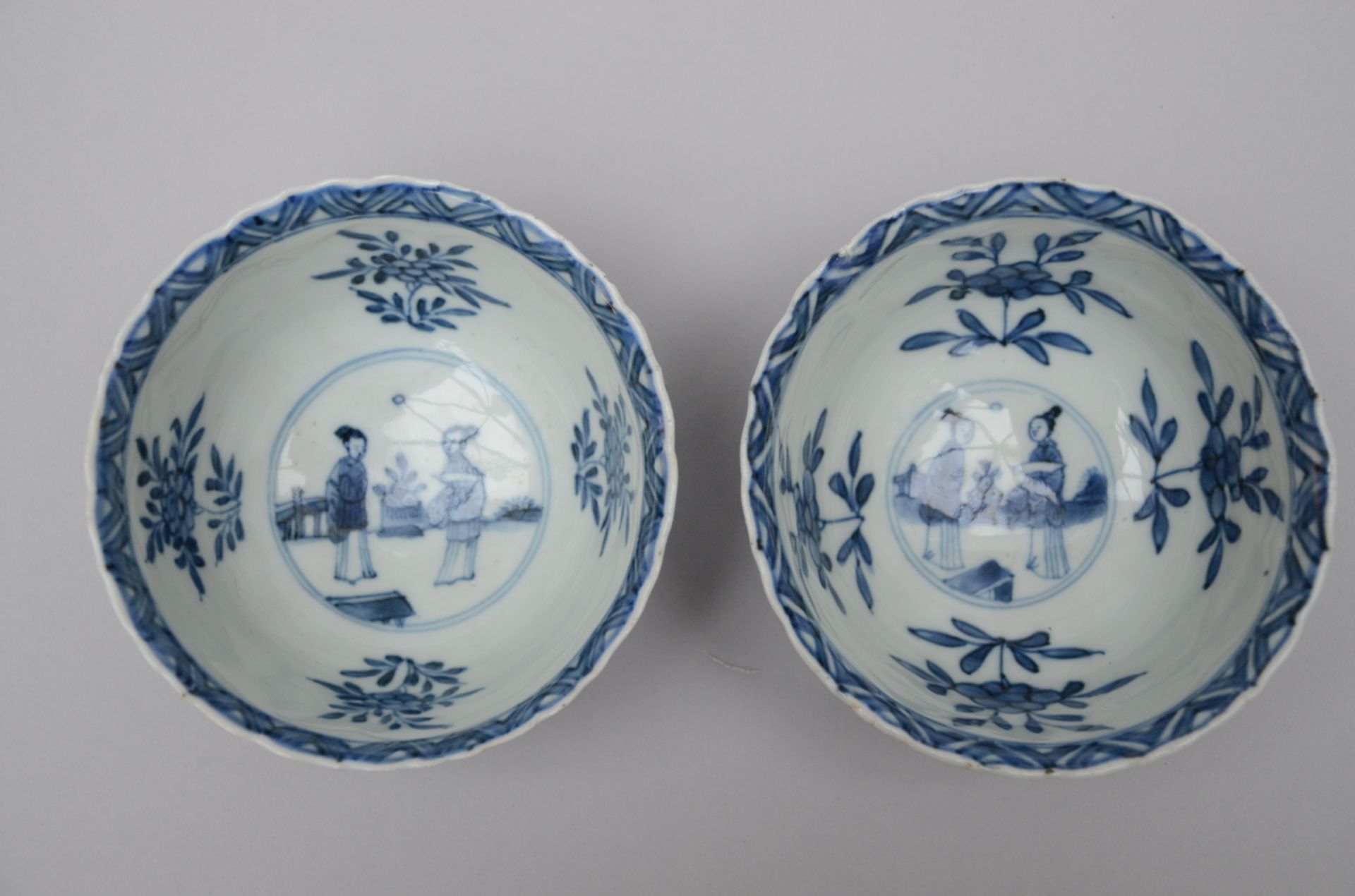 A pair of Chinese blue and white porcelain bowls 'ladies', Kangxi period (6x11 cm) - Image 2 of 4