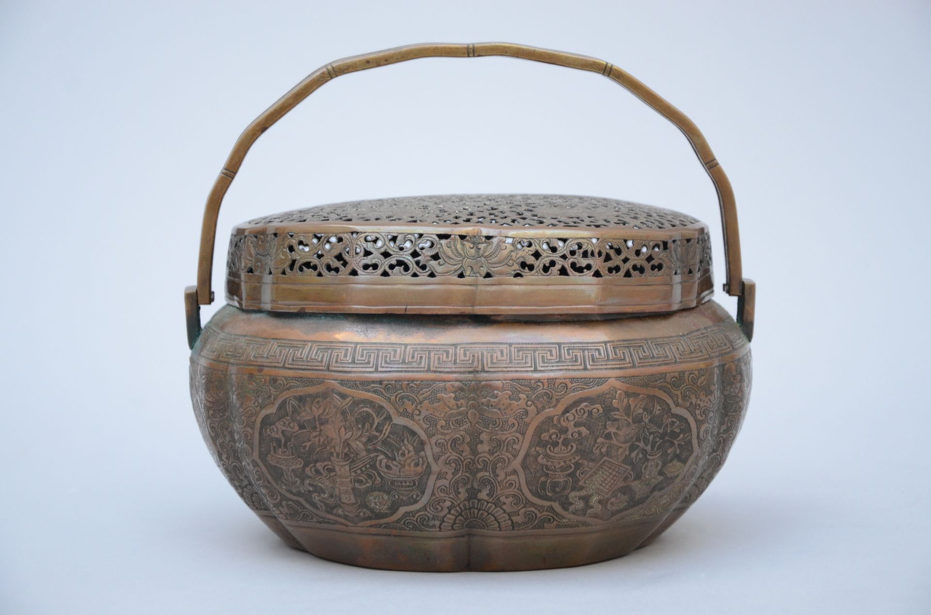 A Chinese bronze hand warmer (12x21x16 cm)