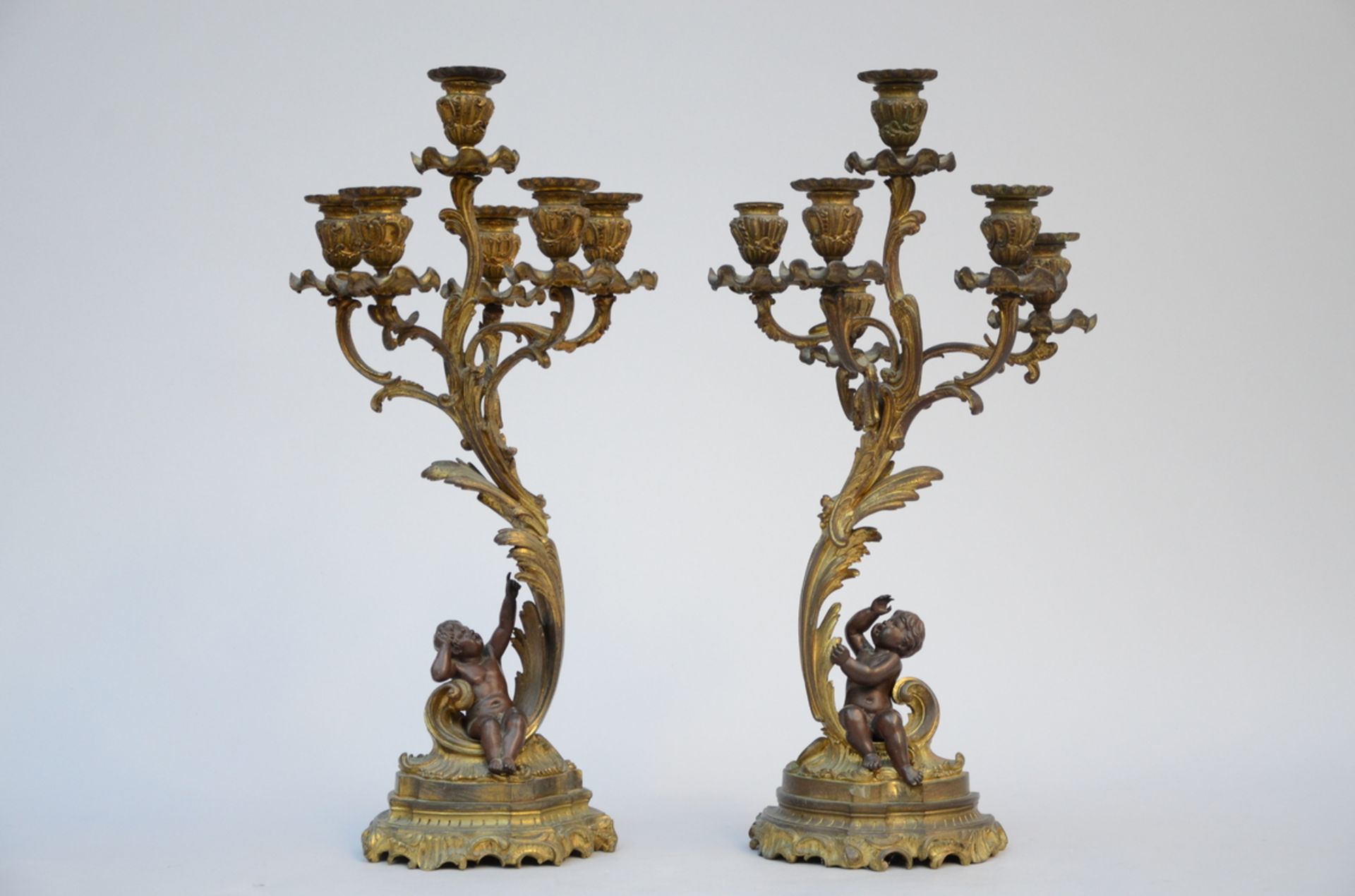 Pair of Louis XV style candlesticks in bronze 'putti' (h58cm)