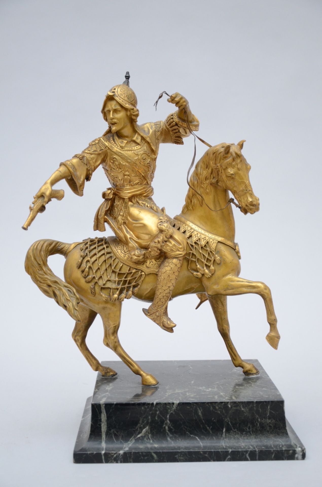 A gilt bronze sculpture on a marble base 'Oriental horseman' (h 43 cm)