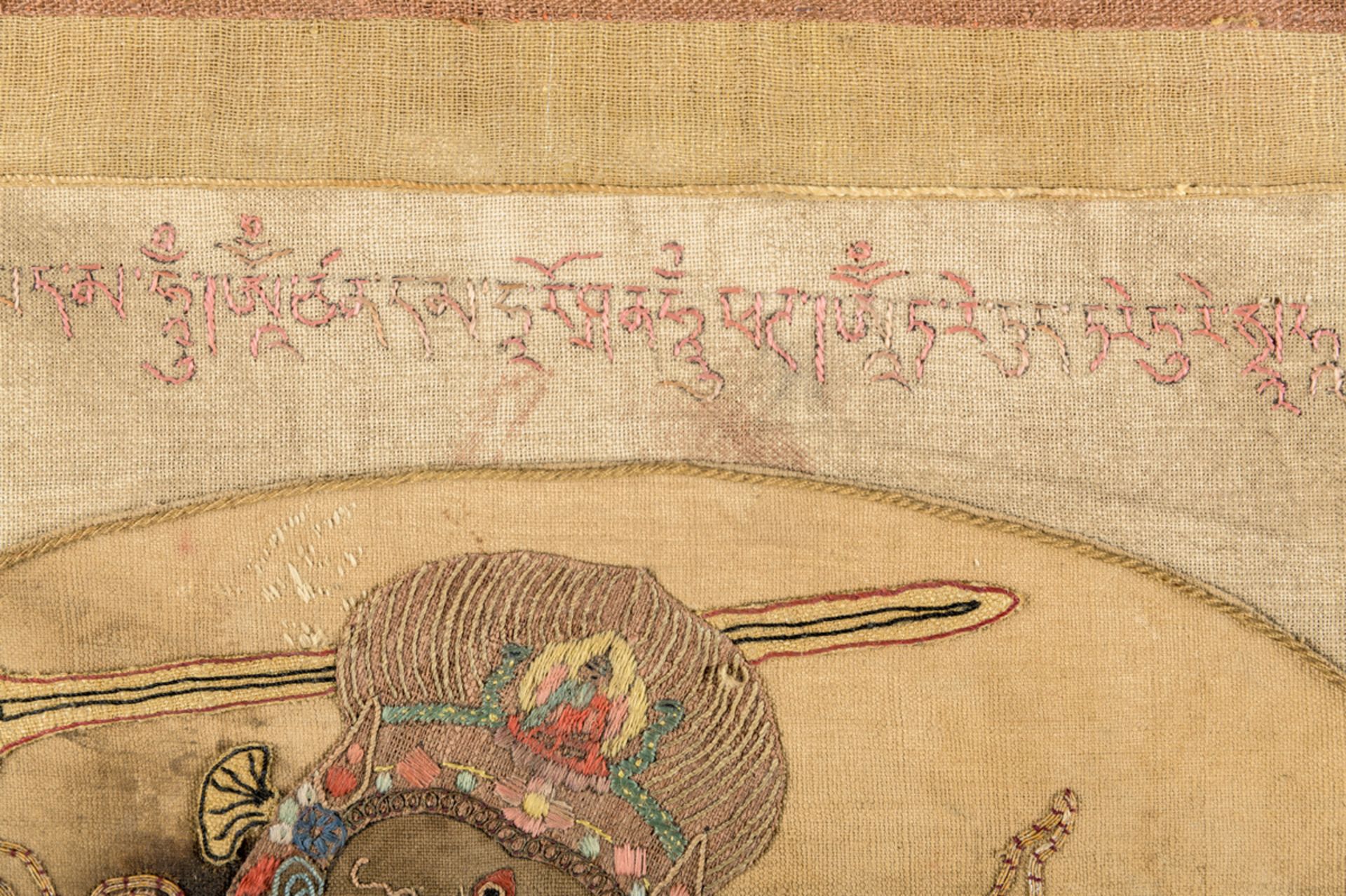 A rare silk appliqué thangka 'Achala', inscriptions (63x46 cm) - Image 8 of 10