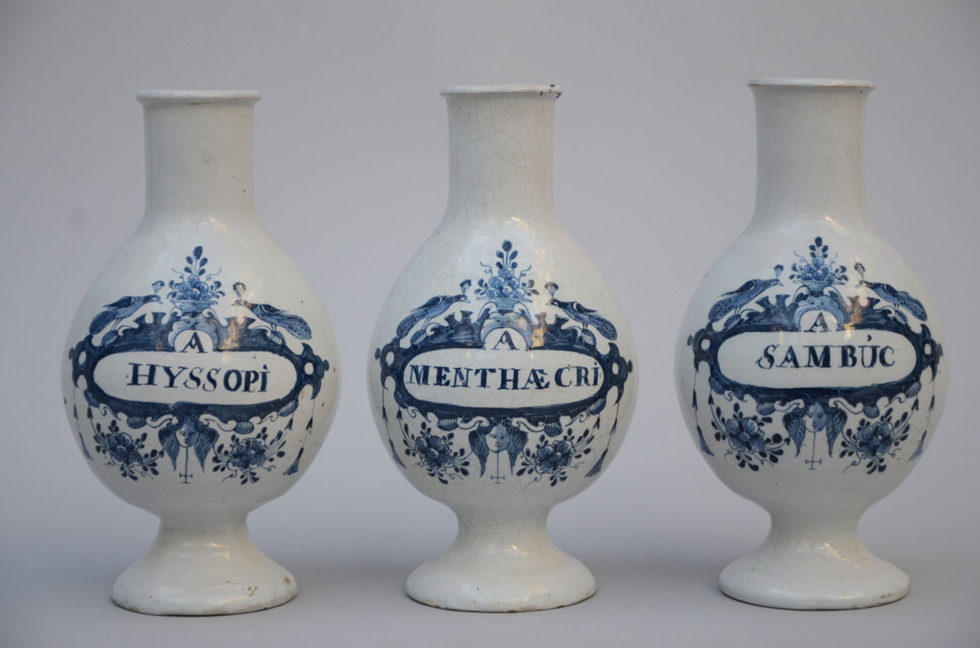 Three faience apothecary vases, 18th century (27 cm)