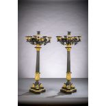 A pair of large Charles X candlesticks in gilt and patinated bronze (h 91 cm)