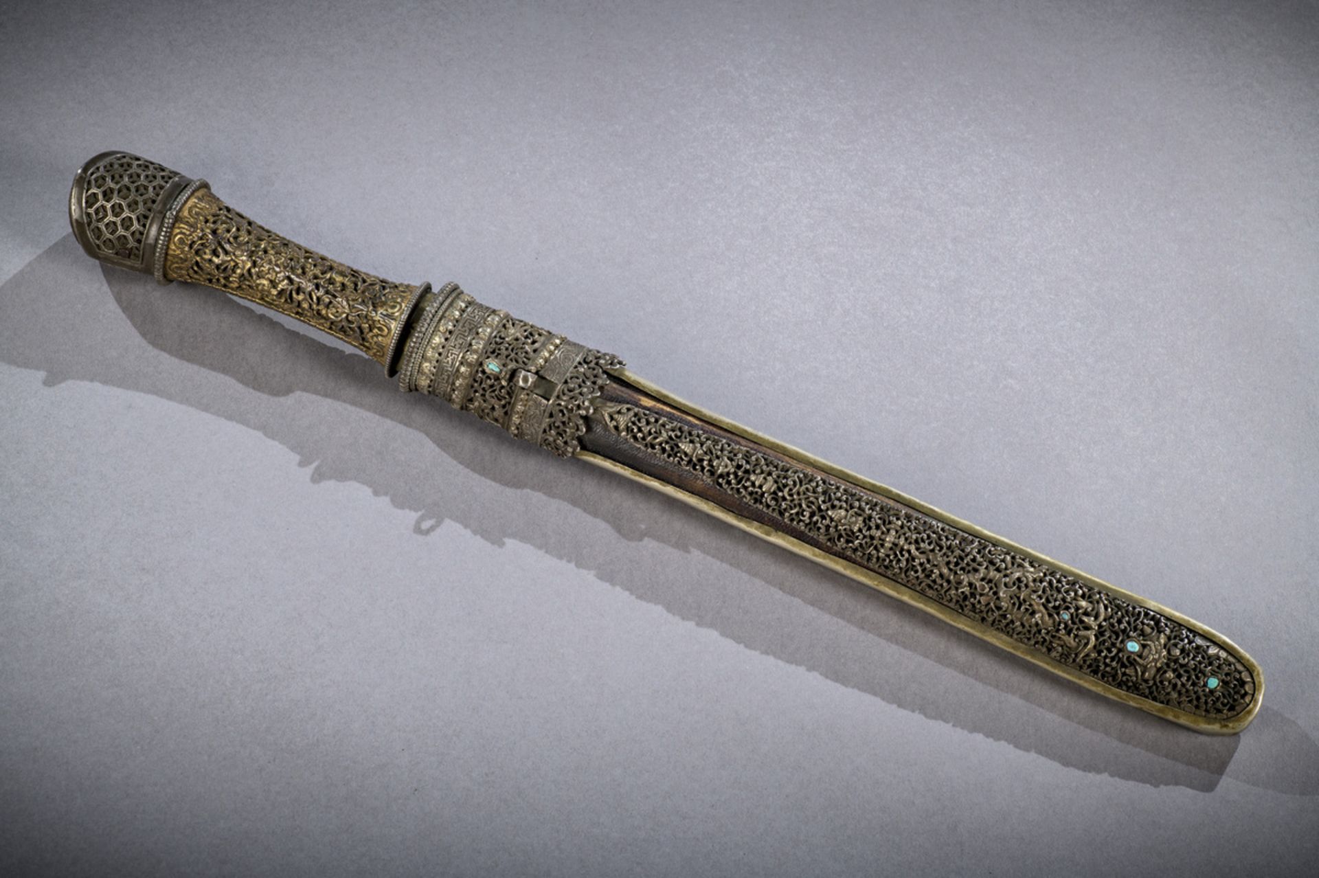 A dagger with openwork iron and gilt bronze decoration, Bhutan 18th - 19th century (tot 46.5 cm)