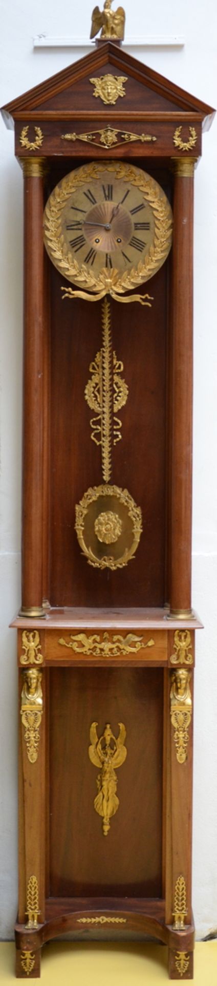 A large standing clock with gilt bronze in Empire style (250cm)