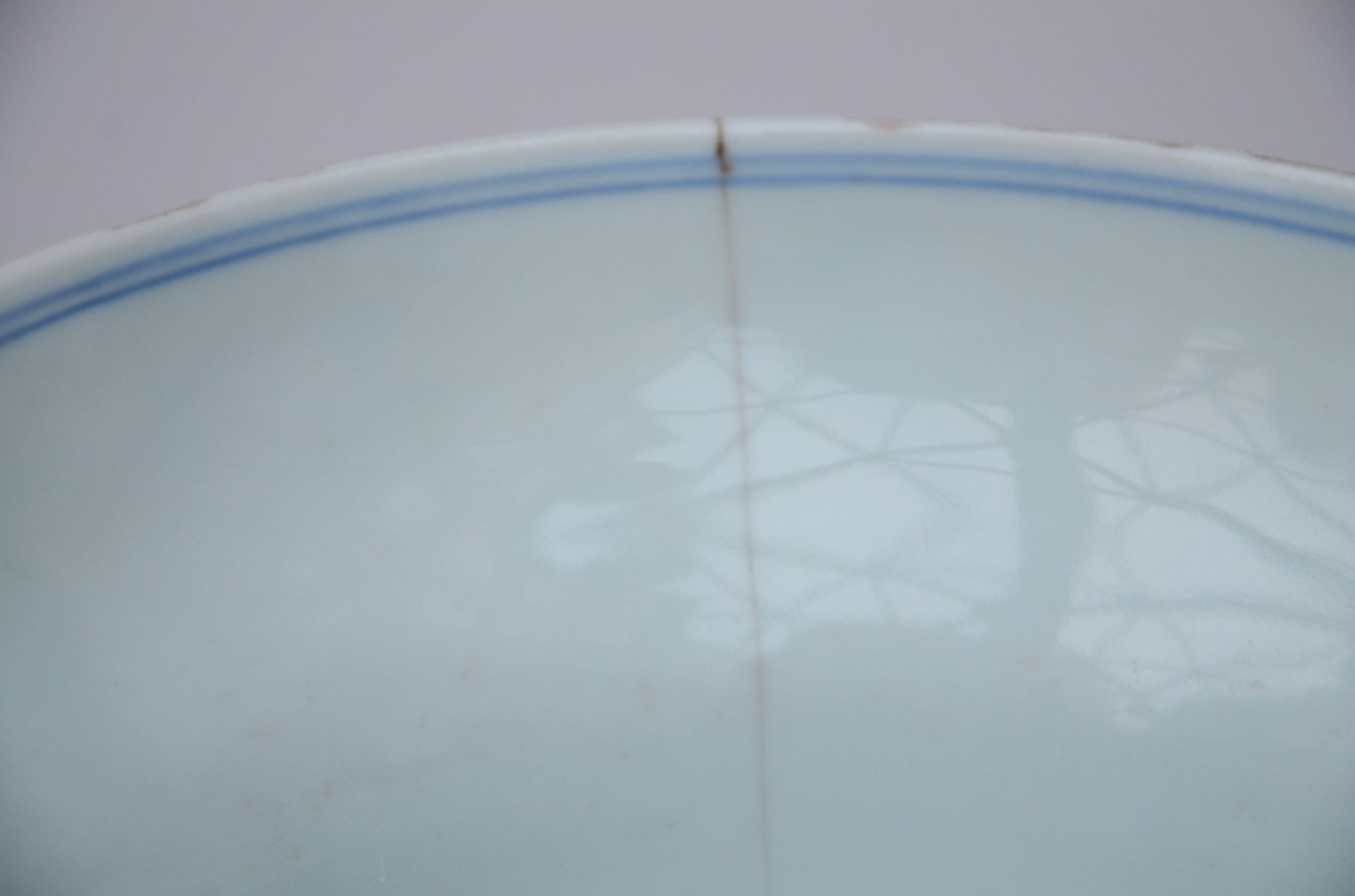 A Chinese bowl in underglaze red and blue porcelain 'fruits', Qianlong mark (10x20 cm) (*) - Image 6 of 6