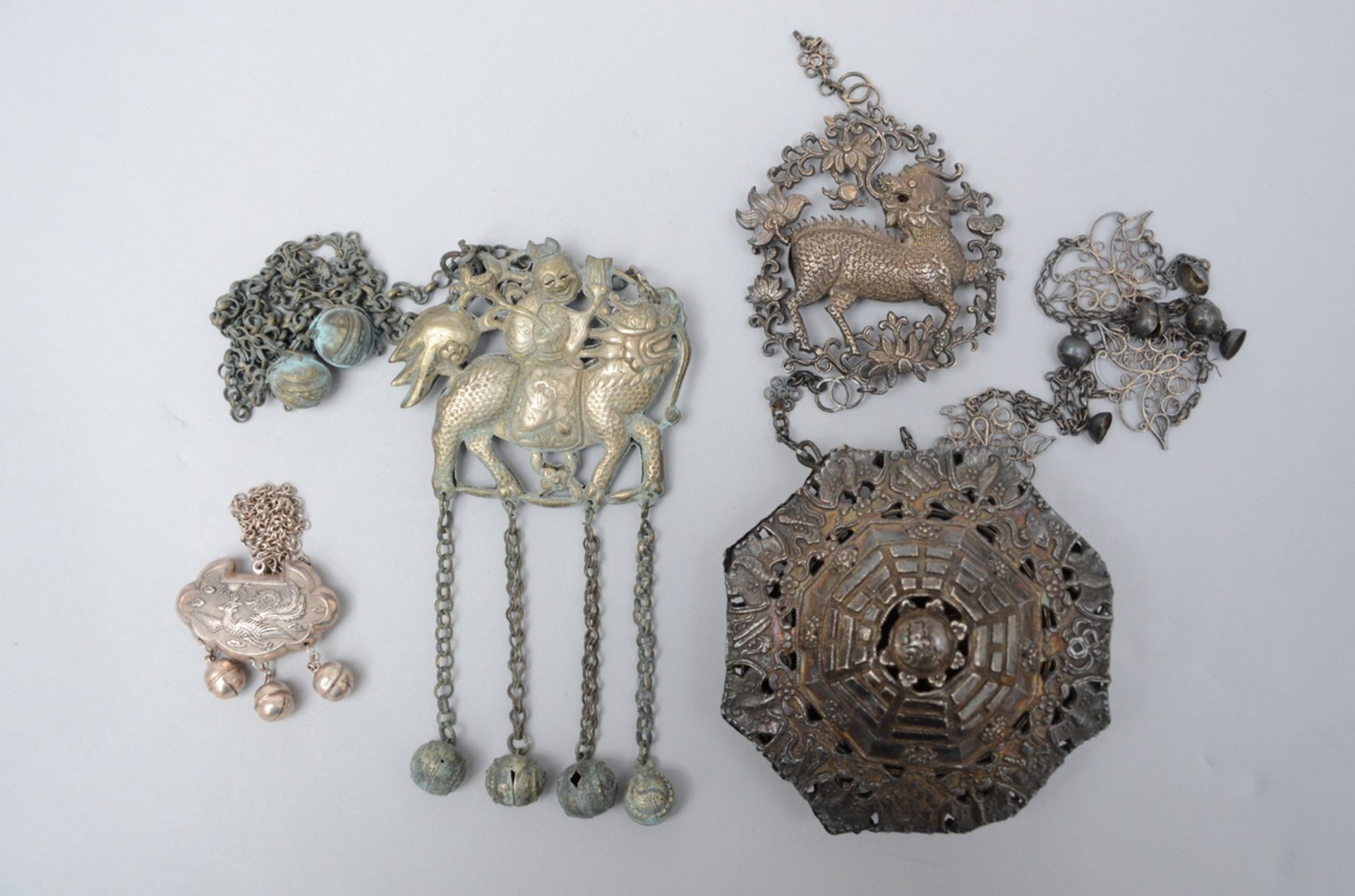 Lot: three Chinese silver pendants