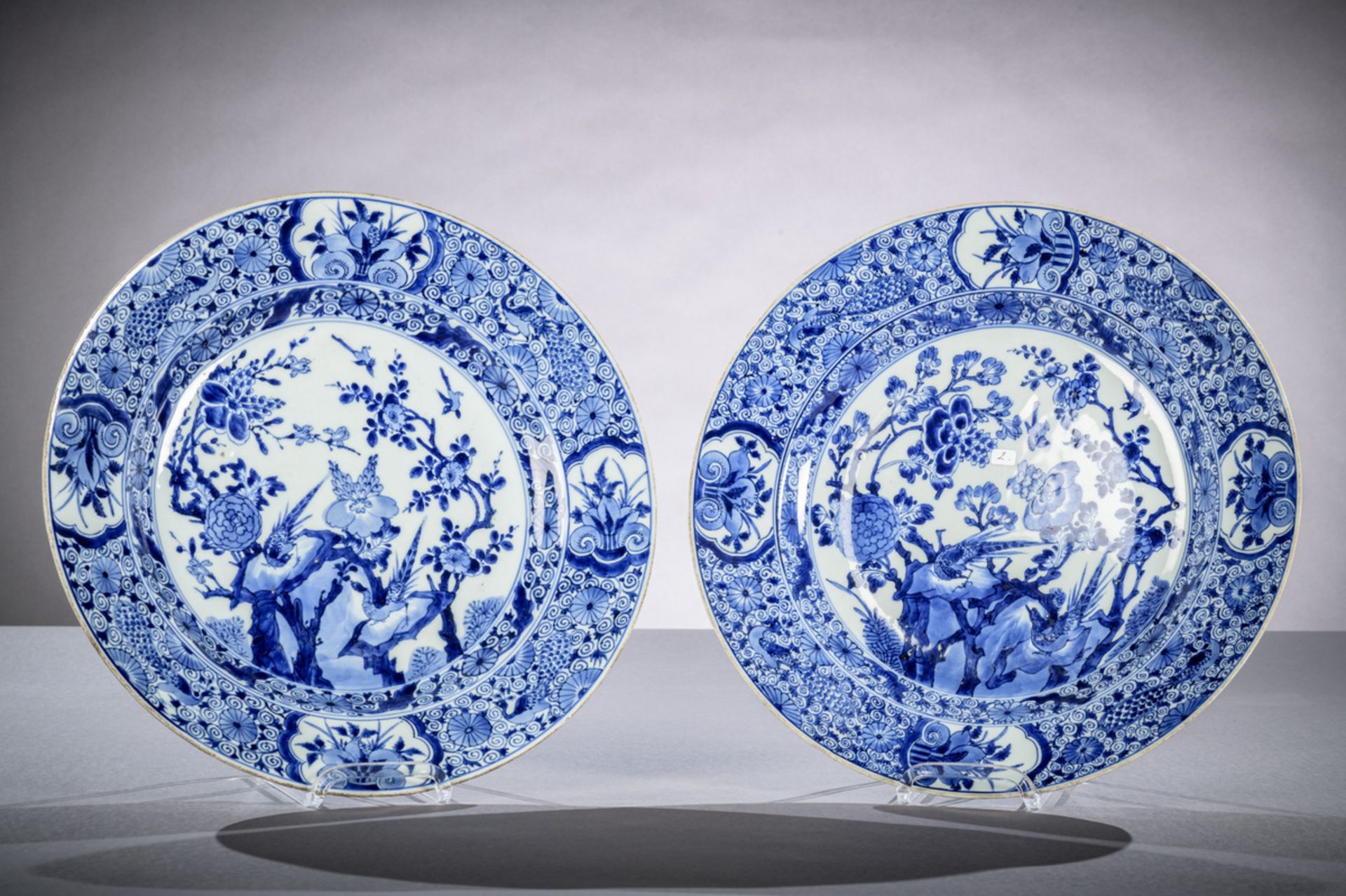 Pair of dishes in Chinese blue and white porcelain 'birds and flowers', Kangxi period (dia 39cm)