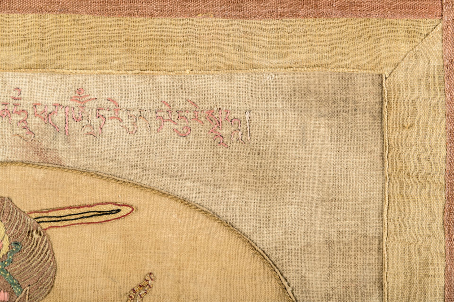 A rare silk appliqué thangka 'Achala', inscriptions (63x46 cm) - Image 9 of 10