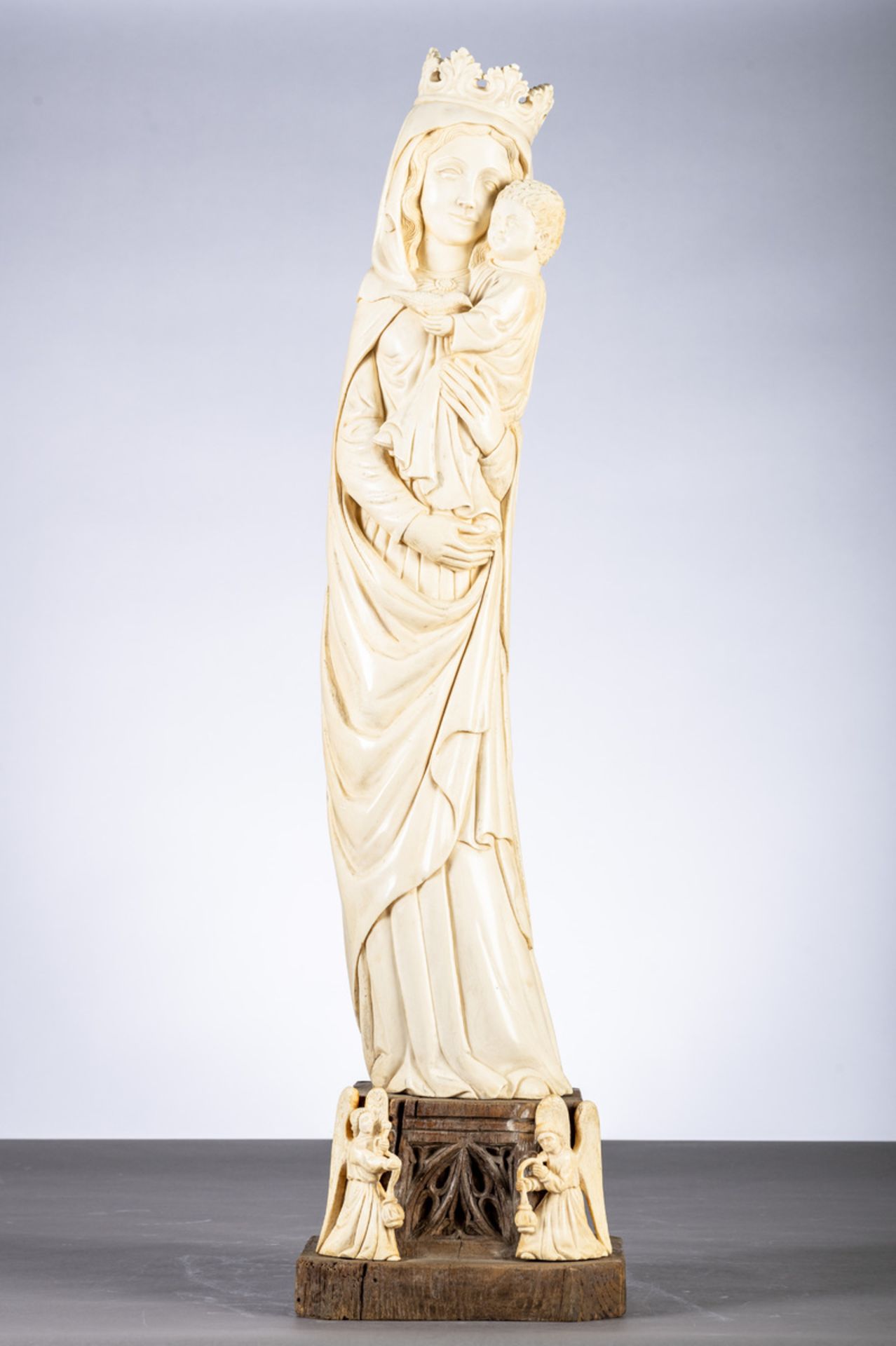 A large gothic revival ivory sculpture 'Madonna and Child', circa 1900 (total height 94cm)