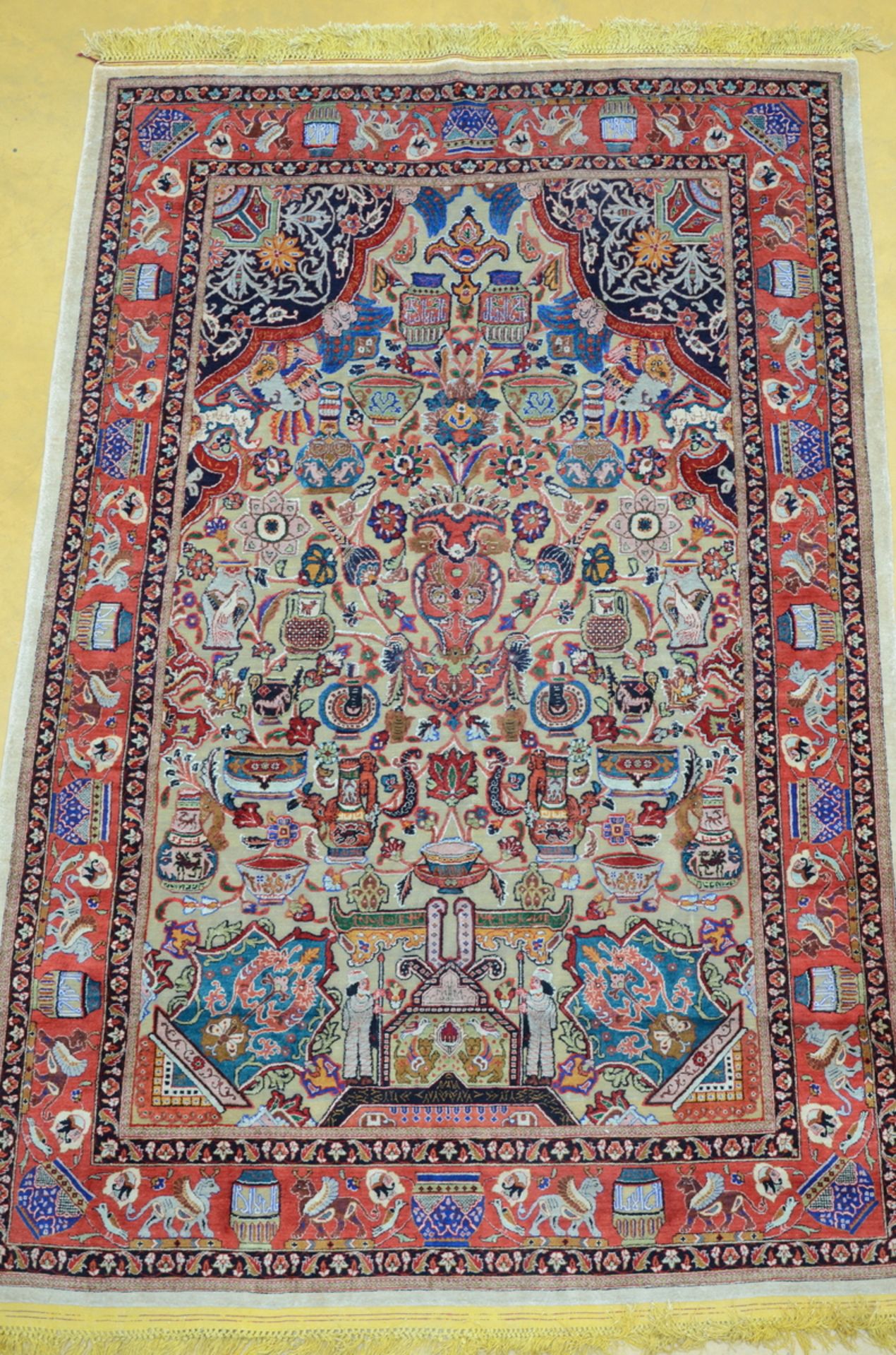 A fine Persian carpet decorated with gold thread 'flowers and vases' (224x142cm)