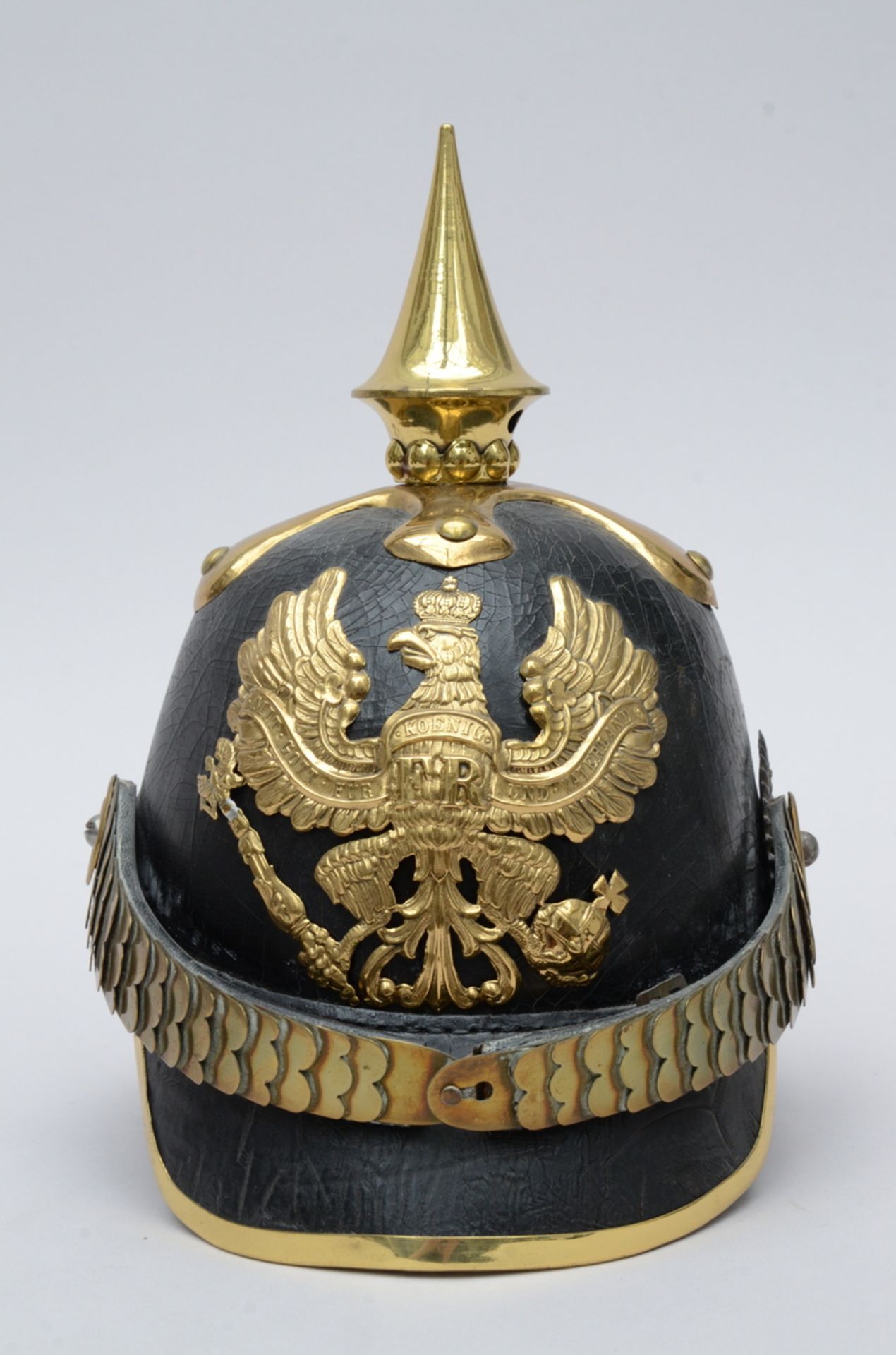 A Prussian leather 'pickelhaube' helmet (h28cm)