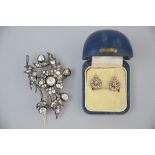 A Flemish brooch in silver + a pair of earrings