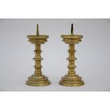 A pair of bronze candlesticks (29cm)+ a plate in polychromed Delft (dia35cm)