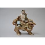 Japanese porcelain statue 'sage on a mythical animal' (37x36x18cm)