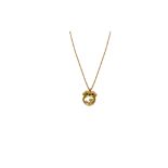 An 18K gold pendant with a 14K gold chain. Gross weight approx. 5.2 cm. Dimensions approx. 1.5 x 1.9