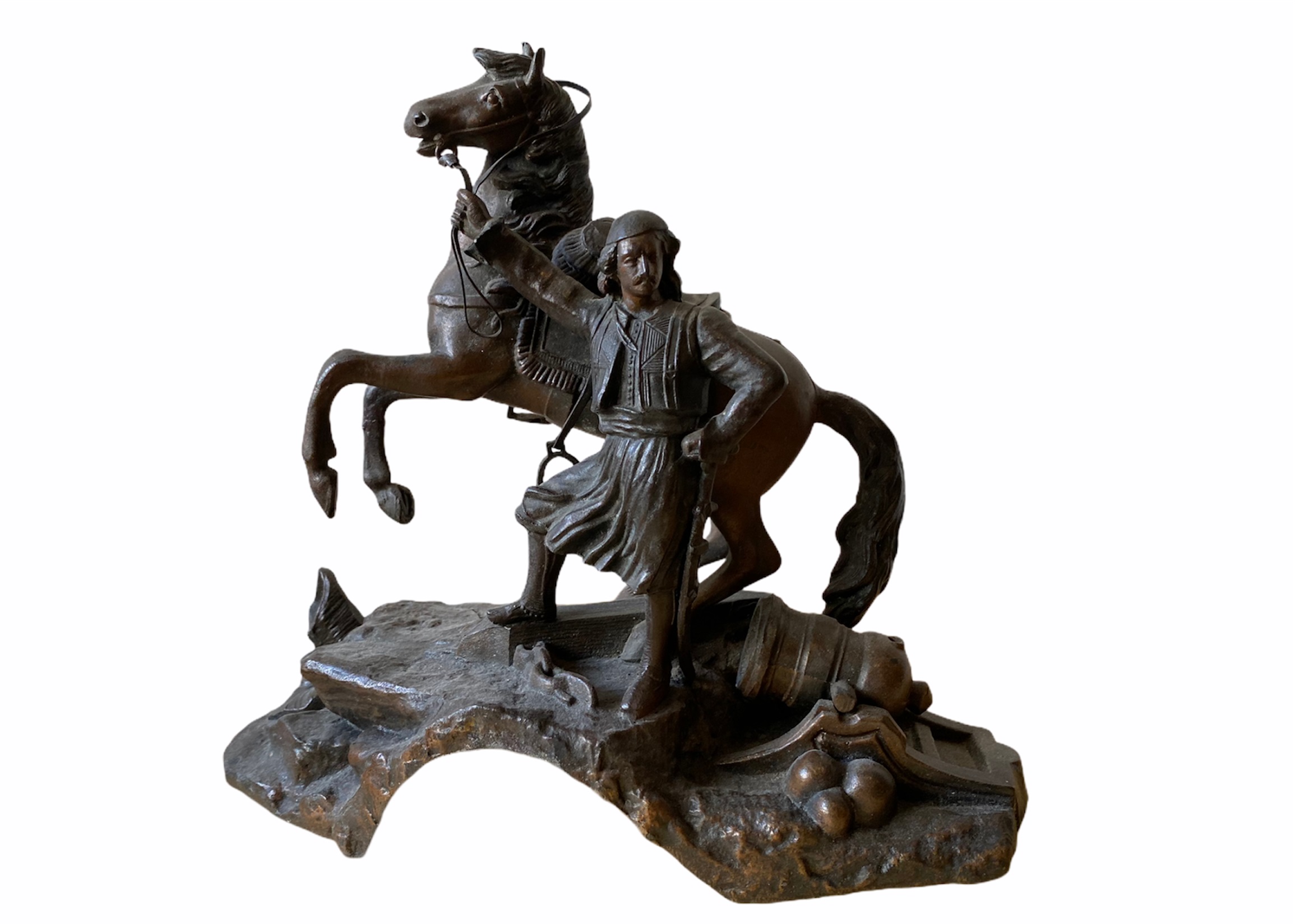 A spelter sculpture of a soldier, probably Greek or Turkish holding his horse. 23 cm (H) x 23 cm (W)