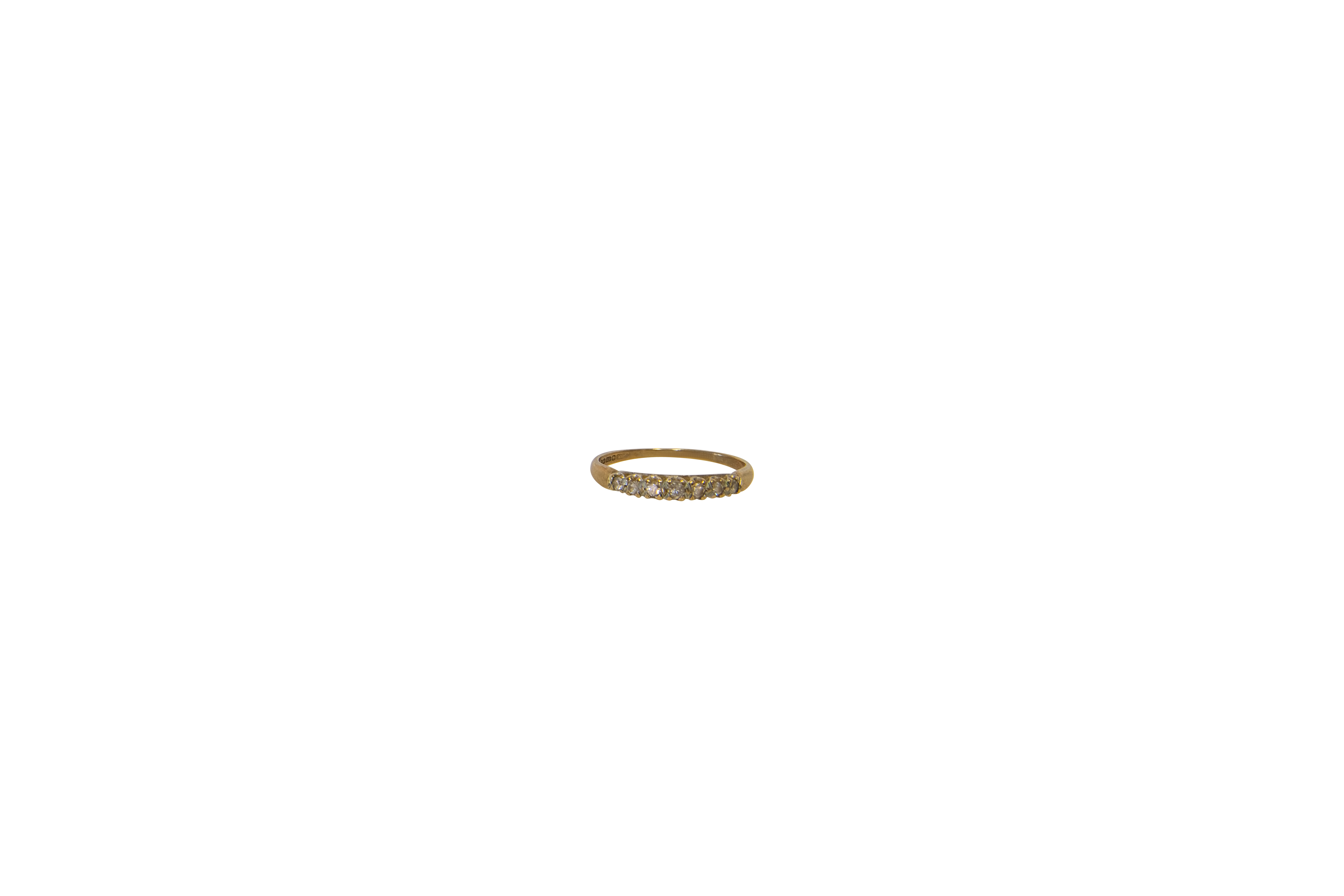 A Lady's white gold wedding ring. Gross weight approx. 1 gr. Size approx. 6 1/2.