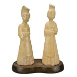 TWO CHINESE STAW-GLAZED POTTERY FIGURES OF LADIES, SUI DYNASTY