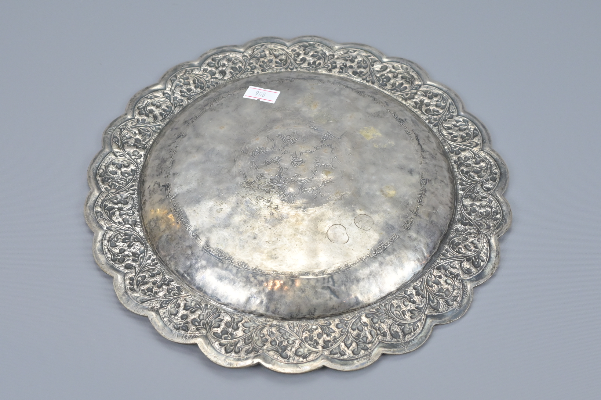 AN INDIAN EMBOSSED WHITE METAL DISH - Image 4 of 4