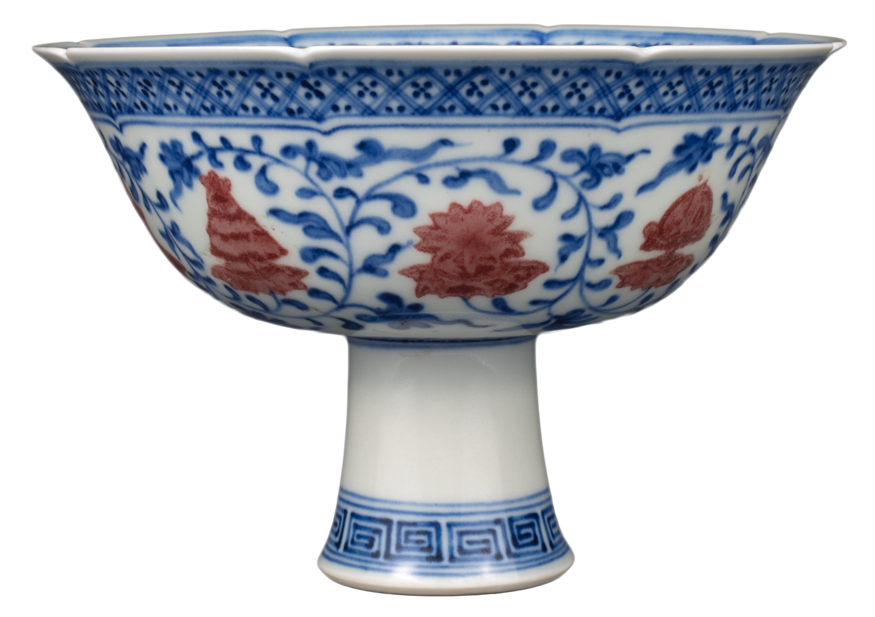 CHINESE UNDERGLAZE BLUE AND RED ‘BAJIXIANG’ PORCELAIN LOBED STEM CUP, QIANLONG MARK