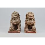 A Pair of Vintage Chinese Carved Wood Seated Lions