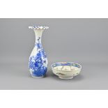 A Japanese Blue And White Porcelain Bottle Vase With Ribboned Rim