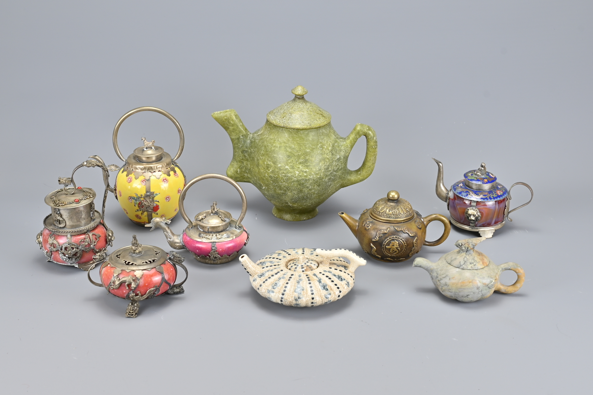 Nine Oriental Teapots