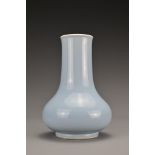 A Chinese clair-de-lune-glazed porcelain vase. The Hu form vase covered in a pale blue glaze