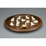 A Chinese set of twelve zodiac animal figures with hardwood tray and miniature plinth. Tray diameter