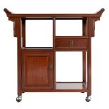 A Chinese hardwood altar cabinet on rounded wheels with two doors and shelves. Height 82 x width