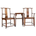 A pair of Chinese Yoke-back armchairs together with a matching two-tier centre table, Huanghuali.