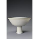 A Chinese 18th Century white-glazed porcelain stem bowl. The bowl decorated in anhua to the interior