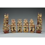 Eight Chinese gilt-lacquer and painted wood carvings of figures and horses