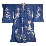 A vintage Japanese Tsukesage Kimono, circa 1930s. The blue ground robe embroidered with